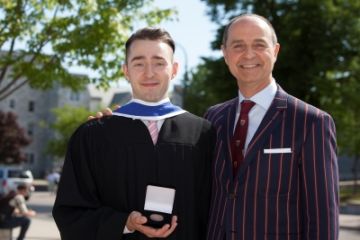 Medal in Law recipient Jeremy Butt, Law’16, with father David Butt, Law’86, outside Grant Hall at Convocation on June 3. (Photo by Greg Black)