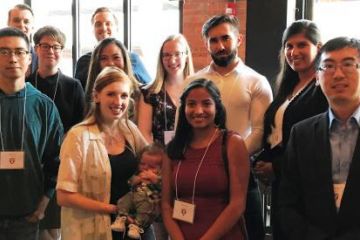 Kevin Guenther, Law’12 (back row, left), Brianna Guenther, Law’12 (front row, 2nd left) with baby Bennett, and Larry Wu, Law’13 (front row, right), met members of Law’20 at a welcome reception in Calgary on August 2.