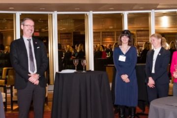 Queen’s Vice-Principal (Advancement) Tom Harris shares a laugh with Dean Bill Flanagan and alumni at a Queen’s Law reception in Calgary on November 8. (Photo by Angela Burger)