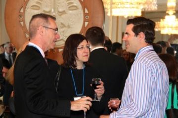 Dean Bill Flanagan chats with Louisa Michelson, Law’89, and Scott Palmer, Law’07, at the reception in Canada's high commission in London.