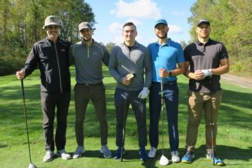 Dean Bill Flanagan on the green at the Loyalist Golf & Country Club with student golfers who participated in the ‘Out Drive the Dean’ competition during the Queen’s Law Fall Classic Charity Event.