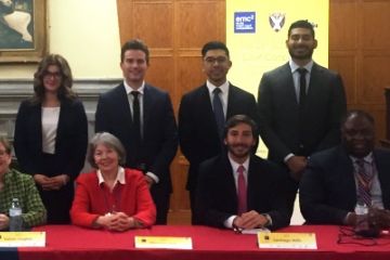 Queen’s ELSA mooters (standing, l-r:) Devon Luca, Cameron Rempel, Brandon Chung and Gurpaul Sandhu, with four judges at the competition.