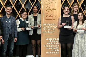 Queen’s Law’s quadruple-award-winning team members of the Immigration, Refugee and Citizenship Law Moot – student coach Levon Mouradian, Law’24 (far left), oralists Ashley Xuzhao and Ravalika Palle, both Law’25 (3rd and 4th left), and oralists Olivia Graham, Law’24, and Olivia Chang, Law’25 (4th and 2nd left) – with moot sponsors at Canada’s Federal Court in Toronto on March 2. (Not shown) student researcher Mo Rahal, Law’24, and academic supervisors, Professor Sharry Aiken and refugee lawyer Andrew Brouwer