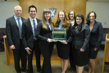 Professor Darryl Robinson, Sean Mitra, Lisa Scheulderman, Stephanie Hodge, Amélie Goudreau, Emily Evangelista and Anastasia-Maria Hountalas (left to right) won the Canadian rounds of the Philip C. Jessup International Law Moot Court Competition.