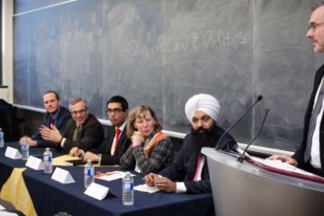 Dean Bill Flanagan (far right), at the Law & Politics panel in Macdonald Hall on Jan. 20, introduces panelists Nathanial Erskine-Smith, MP, Law’10; Tony Clement, MP; Andy Singh, Law’10; Lynne Golding, Law‘87; and Randeep Sarai, MP, Law’01.