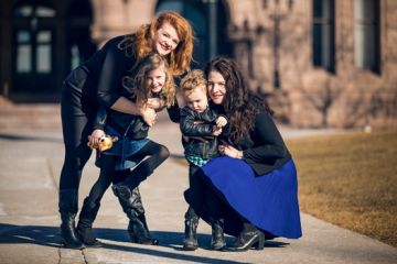 Kirsti Mathers McHenry, Law’03 (right), with wife Jennifer and their children, Ruby and Cy, at Queen’s Park on February 20 – Family Day in Ontario (Photo by Rai Allen)