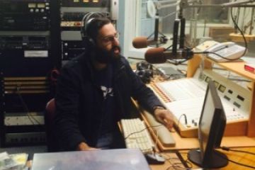 Jonathan Nehmetallah, Project Lead of Pro Bono Radio, broadcasts a show at the CFRC station at Queen’s.