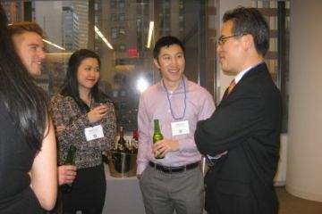Photo by Jennifer Dumoulin. Joon Park, Law’99 (right), talks to students about his experiences working and living in New York City.