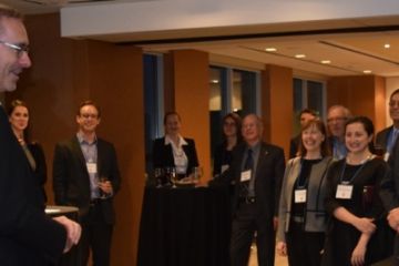 Alumni in Ottawa enjoy hearing about recent developments at Queen’s Law from Dean Bill Flanagan (far left) at a reception. (Photo by Viki Andrevska)