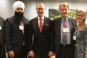 Dean Bill Flanagan (third left) with alumni at an Ottawa reception in the Parliamentary Boardroom of Dentons LLP. (Photo by Viki Andrevska)