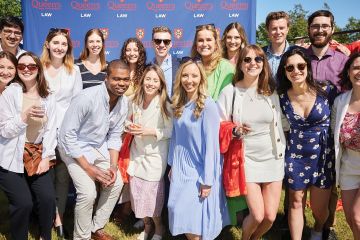 Enthusiastic business law alumni from the classes of 2017 to 2021 gathered for the QBLP Garden Party hosted by Associate Dean Mohamed Khimji, Queen’s Business Law Program Director, in Prince Edward County in June 2022. (Photo by Eightbyten)