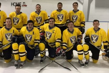 Colby Harris, Law’19 (2nd left) and his Queen’s Law hockey teammates, shown before a game at the Invista Centre, are partnering with the Law Faculty and Kingston Frontenacs for the 2018 Winter Classic.
