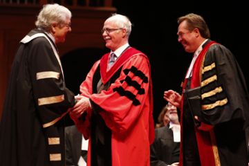 Photo courtesy of Law Society of Upper Canada. LLD honoree John Sims, QC, Law'71, is congratulated by his hooder, former Chief Justice of Ontario Roy McMurtry. Looking on is then-LSUC Treasurer Tom Conway, who presided at the Call to the Bar ceremony in Ottawa on June 23.