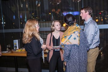 Students and alumni discuss things Queen's Law at a reception in Vancouver.