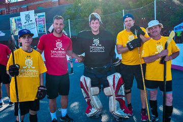 Tournament co-founders Taylor Hall (2nd left) and Kevin Bailie, Law’19 (middle), with Nicholas Osanic, aspiring member of Law’25, Aaron Fransen, Law’04, and Phil Osanic, Law’91, LLM’02, at the charity event in downtown Kingston on July 29. (Photo by Jackie Li)