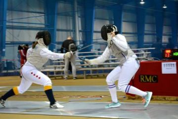 Kyra Dorfman, Law’18 (left) engages a fencing opponent.