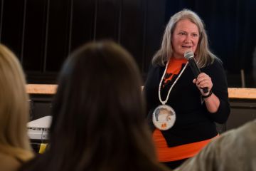 Federally appointed Independent Special Interlocutor Kimberly Murray presents “Sites of Truth, Sites of Conscience,” her July 2024 report on unmarked burials and mass graves of missing and disappeared Indigenous children in Canada, to Queen’s University community members in Grant Hall on Sept. 26. 