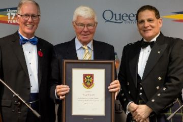 David Pattenden, Law’71, LLD’03, accepts his Distinguished Service Award from Chancellor Jim Leech and Principal Daniel Woolf, at the University Council Dinner in Ban Righ Hall on Nov. 5. (Photo by Garrett Elliott)