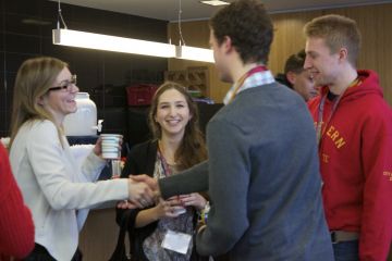 Current students greet prospective students at a Welcome Day reception in the student lounge on March 6.